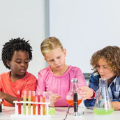 Children experimenting with test tubes.