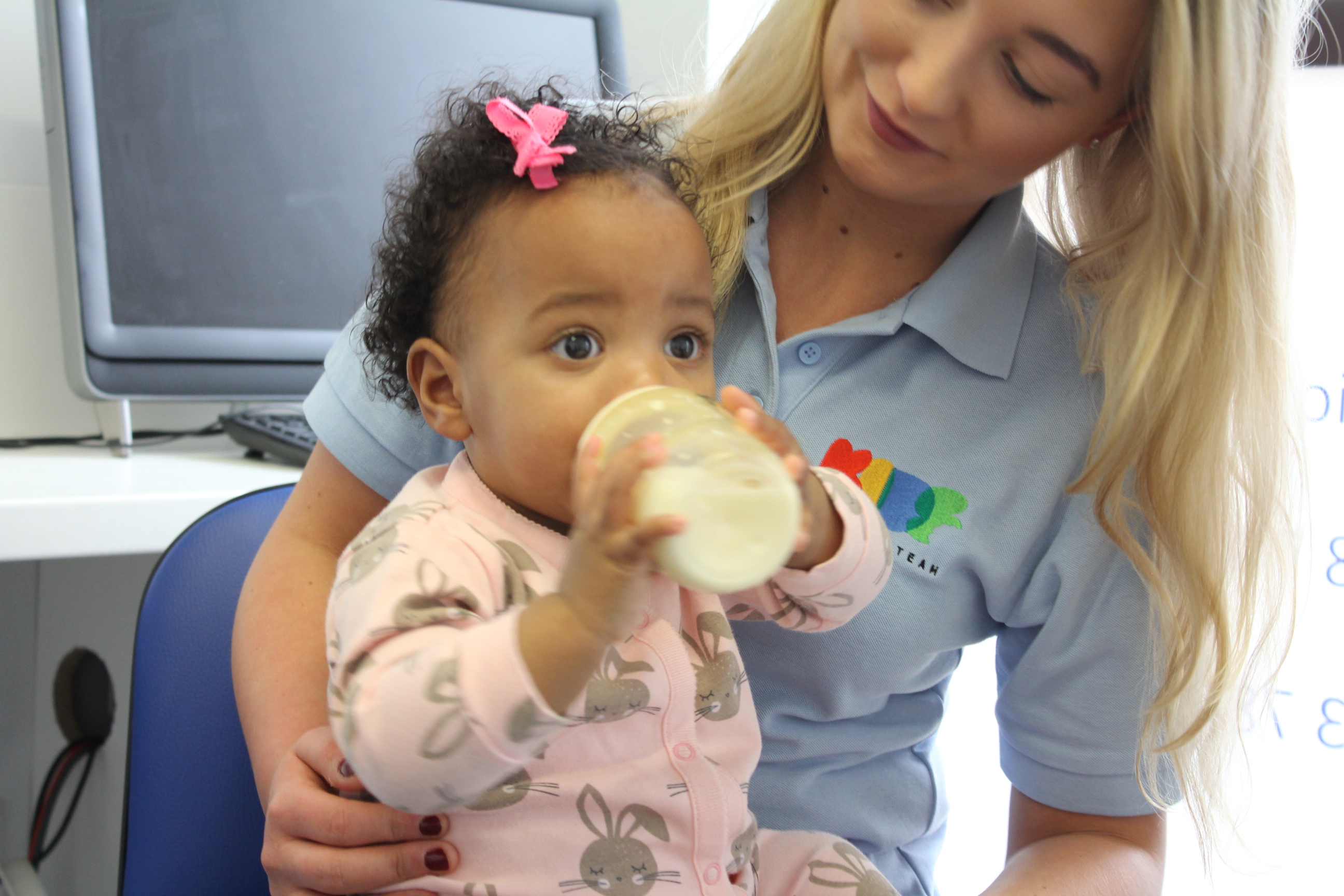 Jada feeding with bottle sat on Saffron