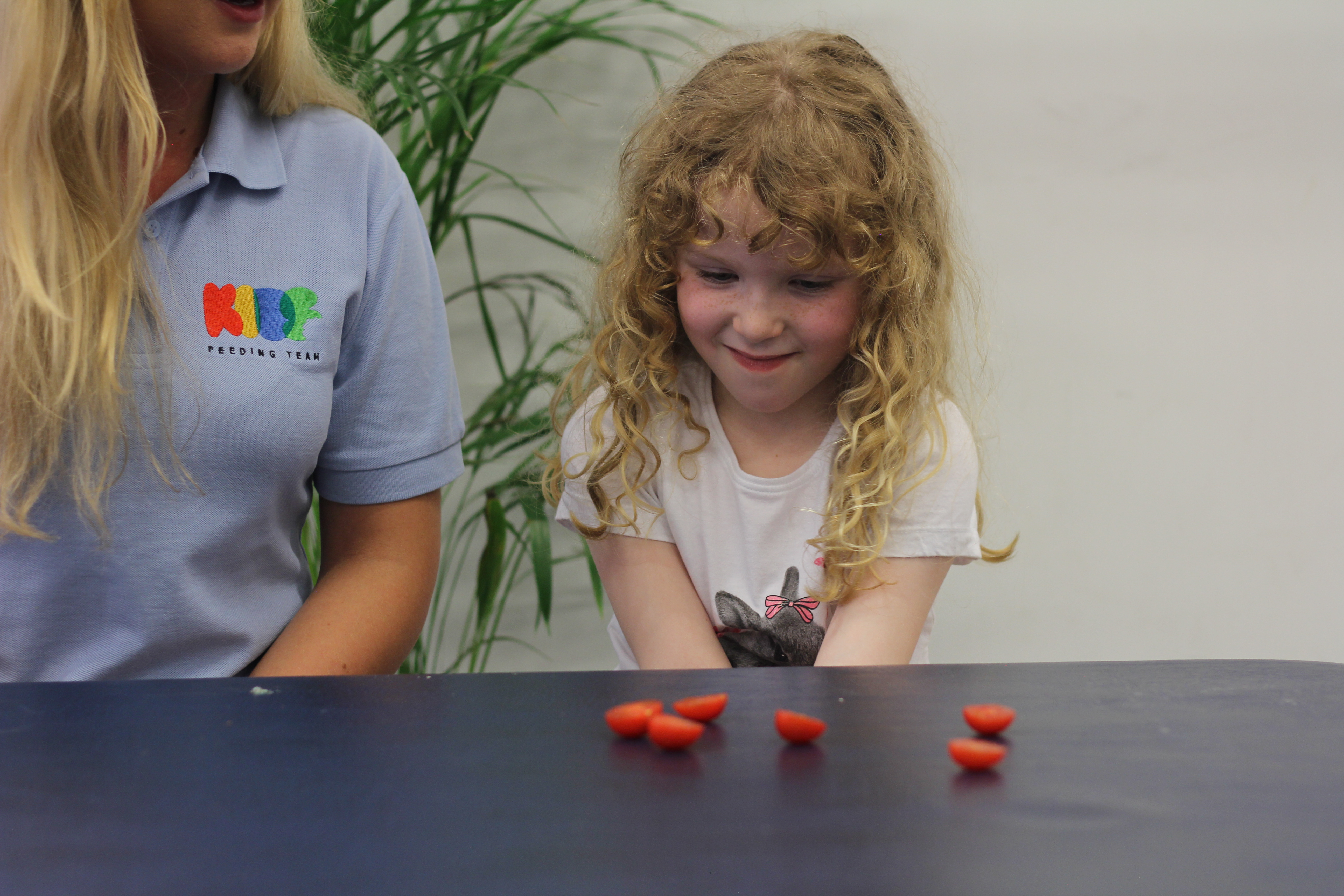 Macie smiling with strawberries