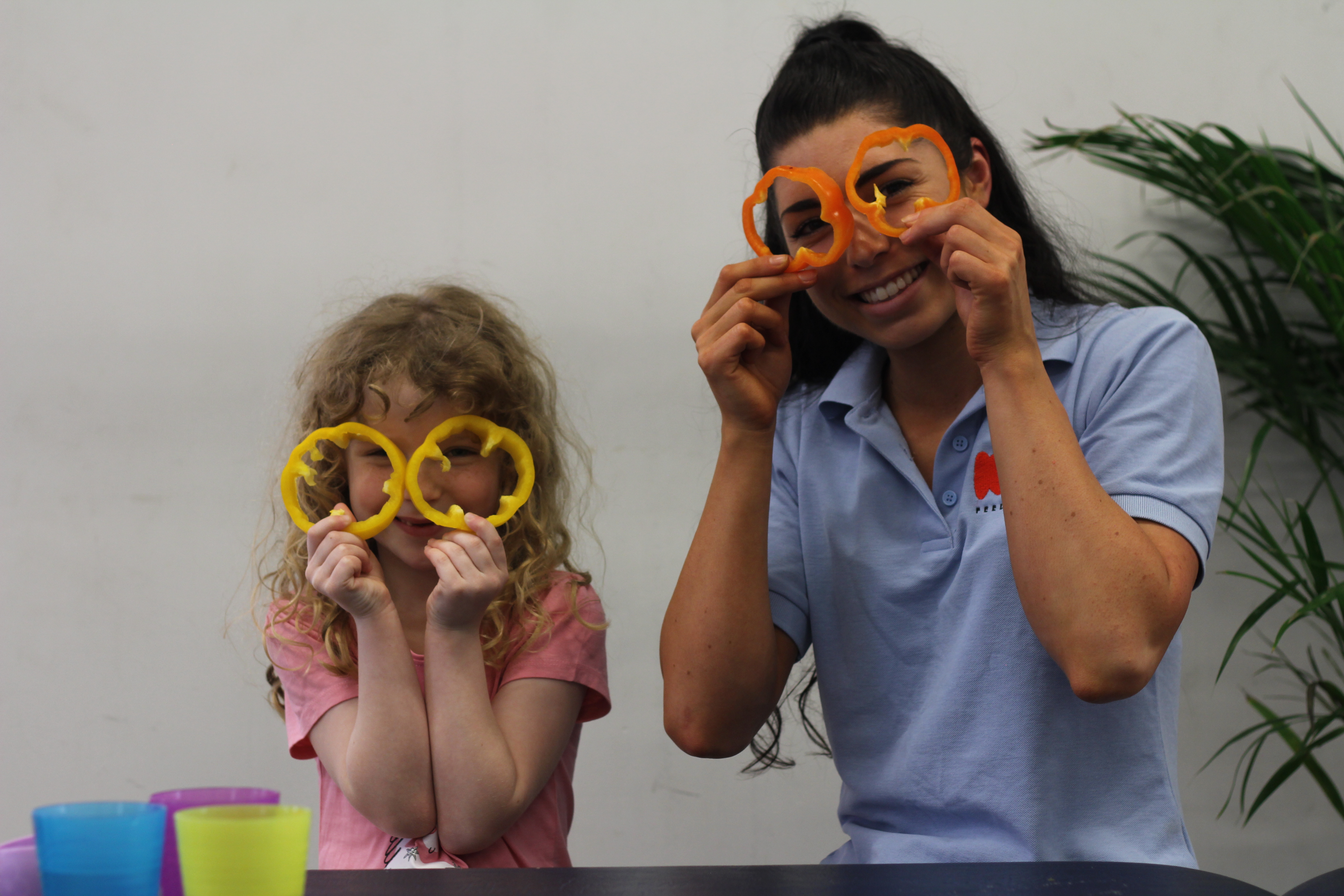 Macie and Jade with peppers for eyes