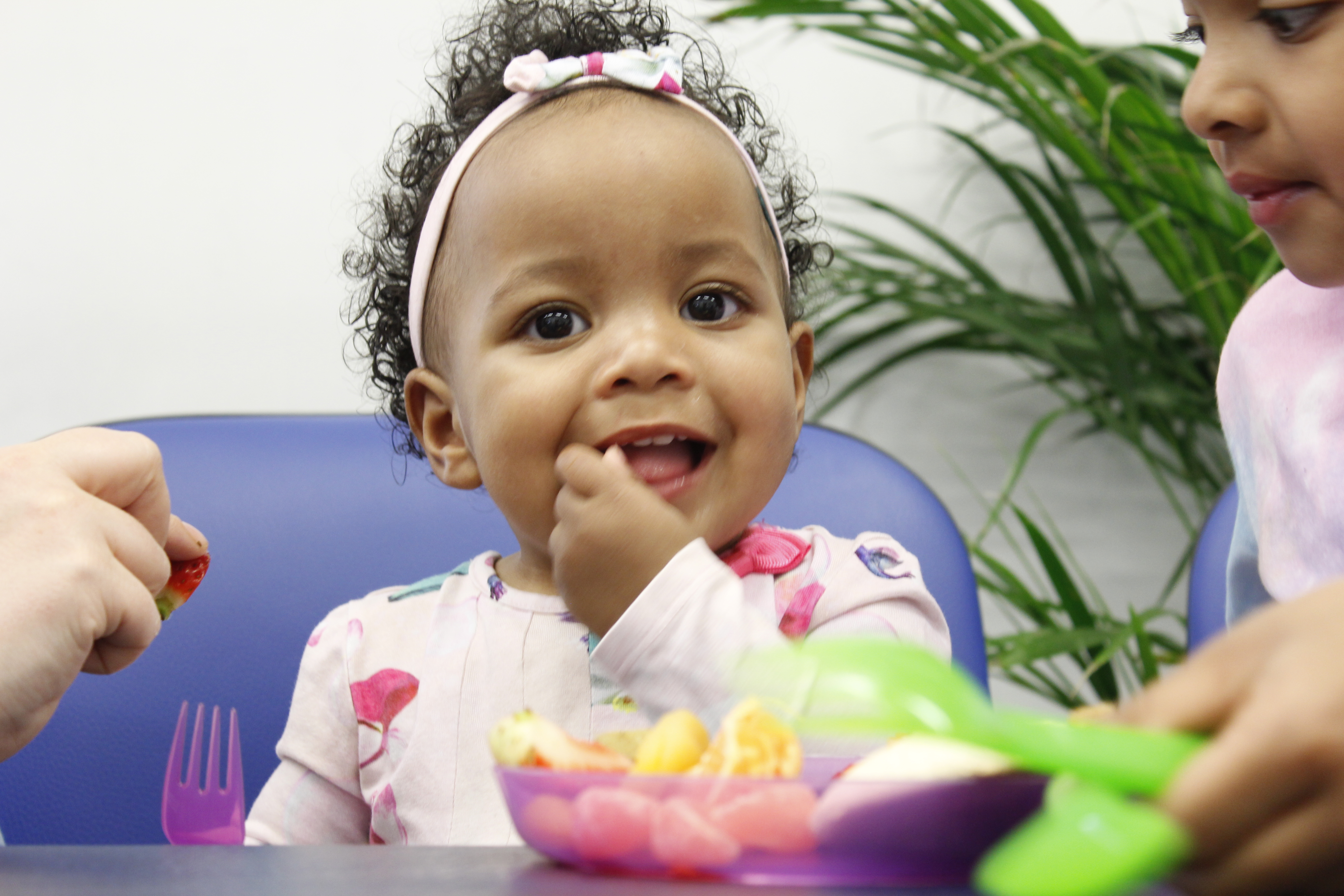 Jada eating fruit at table