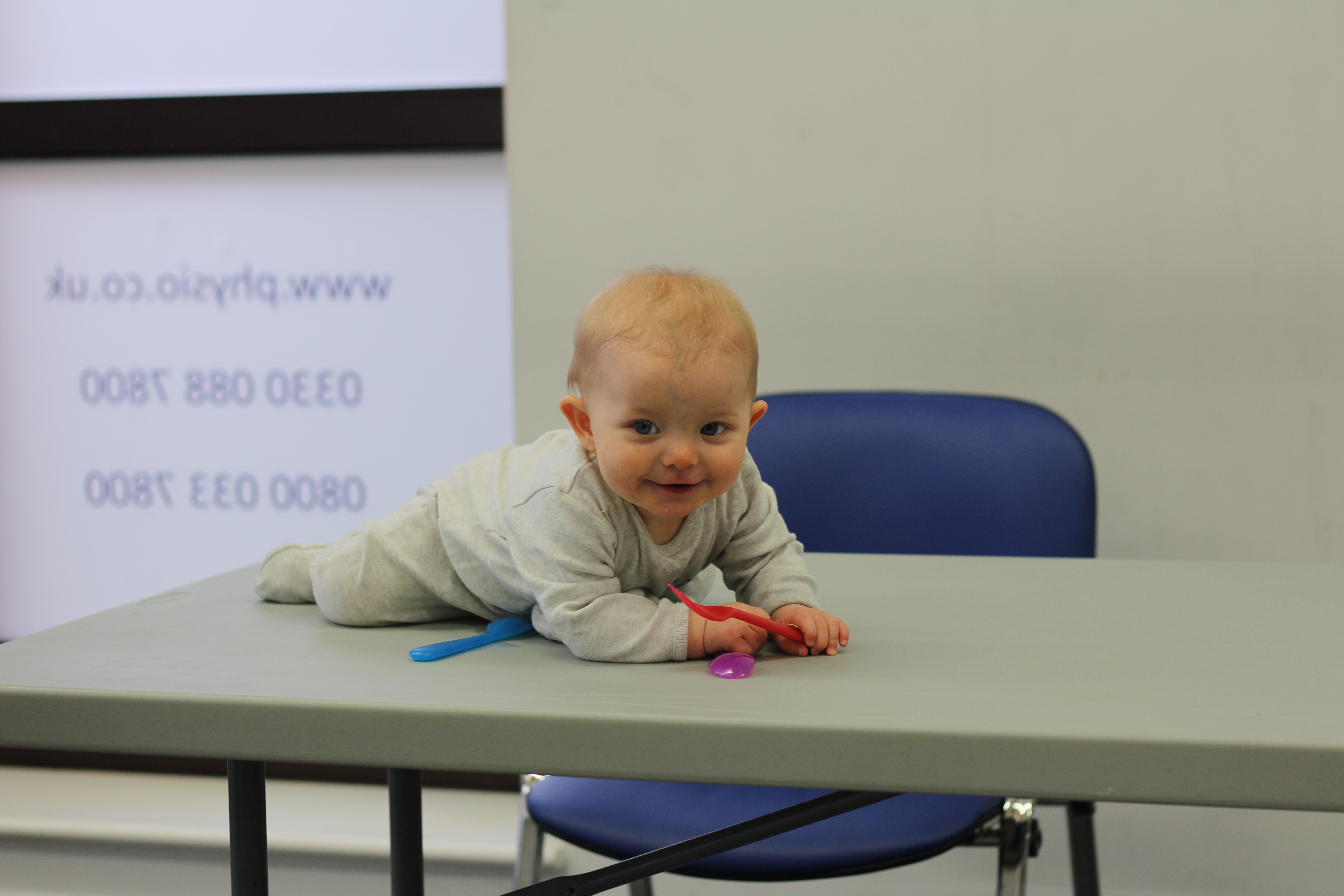 Albie on table smiling